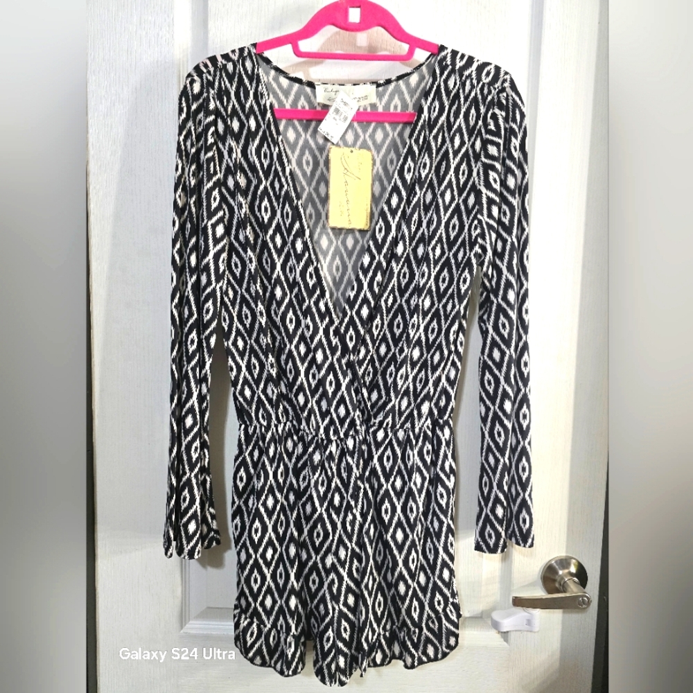 Never worn long sleeve romper.